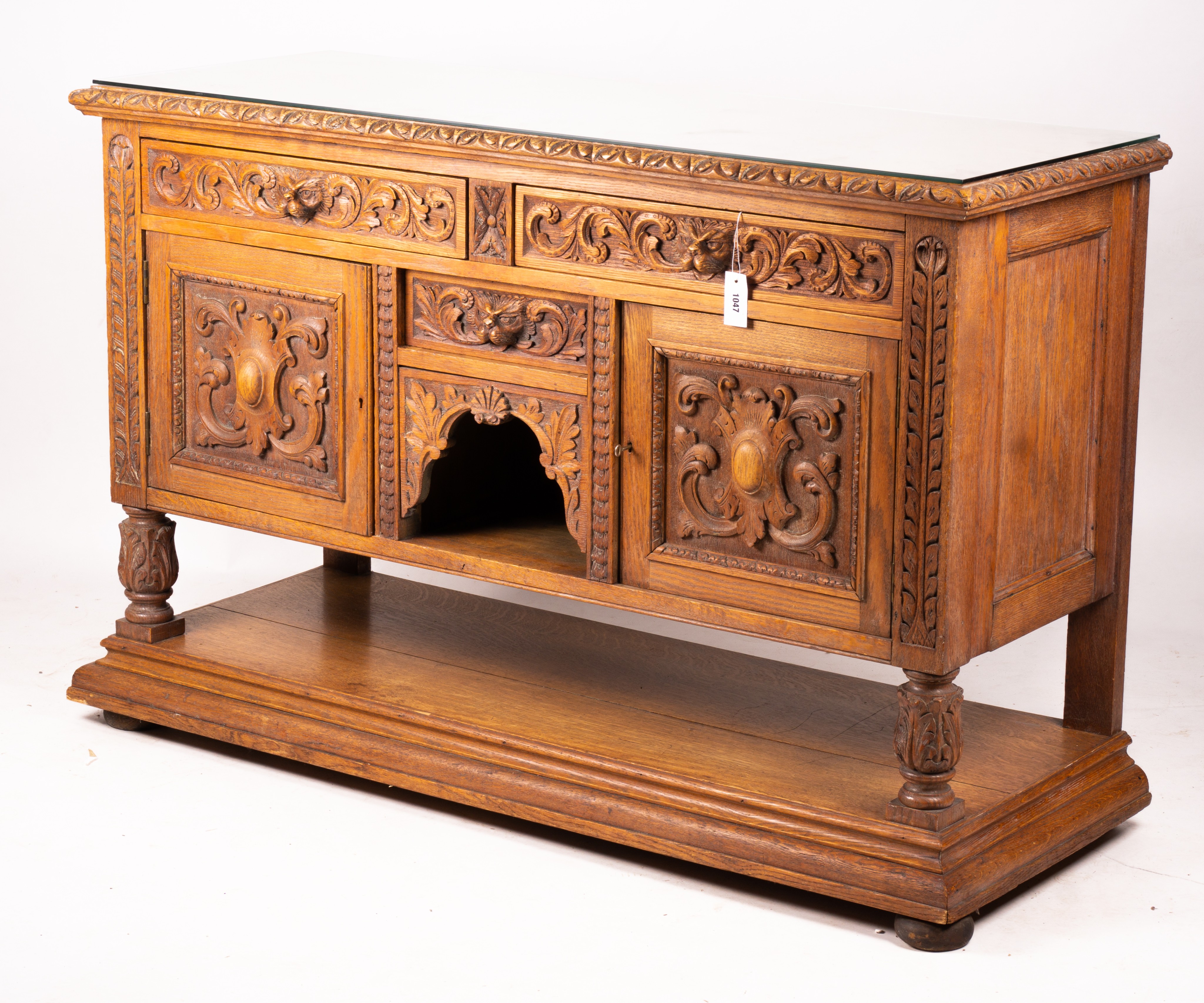 A late 19th century Flemish carved oak buffet, length 158cm, depth 58cm, height 99cm